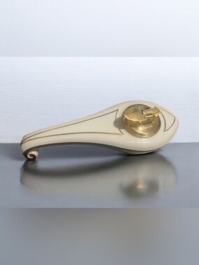 Vintage 1950s Ronson "Varaflame Fantasy" gold and white ceramic table lighter.